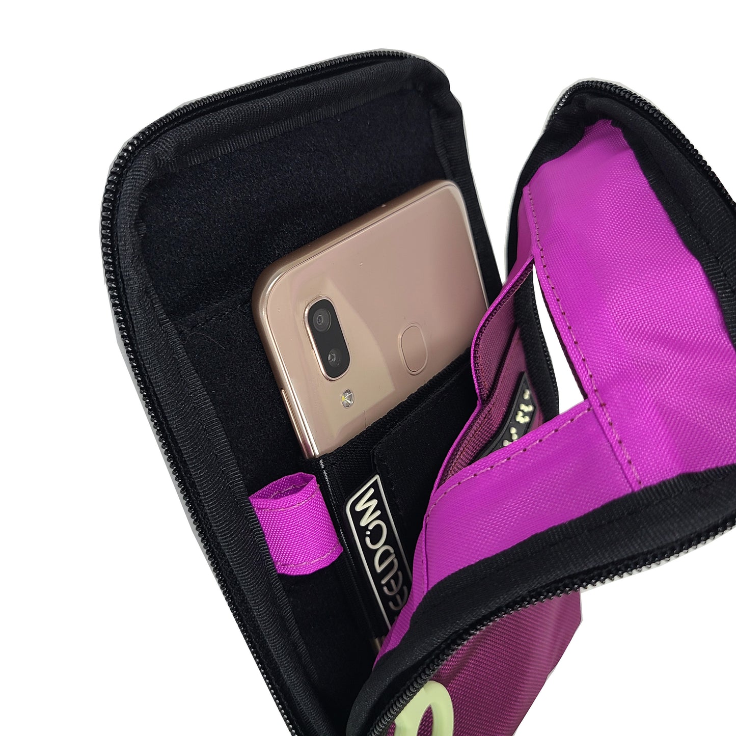 A Purple Navi Pal is zipped open showing a bright purple (Fuschia) lining, and a smartphone in its holster which is attached by velcro to the back side of the pouch. The phone's camera is front facing, lined up with the small window on the front of the pouch. There is a pen loop on the left inside of the pouch.