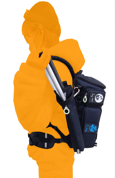An orange silhouette of a person wearing the City Block backapck, side view. They are reaching back to take the cane out of the cane pouch which is attached to the side of the backpack with a carabiner. The person has fastened the waist strap around their waist. The colorful braille patches are visible on the side pockets.