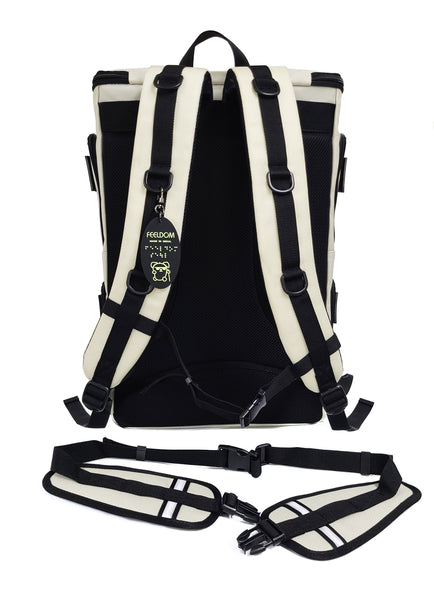 Back view of the Arctic White Large Backpack with black trim and black back cushion. Removable belt is black and white with reflective strips. There is a glow in the dark Braille design keychain attached to one of the 6 D rings.