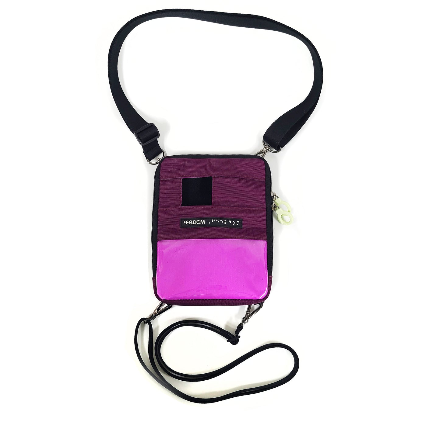 A Suare zippered pouch with a 3 x 5 clear plastic window on the lower half. The bright lining shows through when no badge is placed in the window. There is a small square opening at the top to place the camera. Wide neck strap and thinner waist strap, and a Feeldom braille label runs across the middle.
