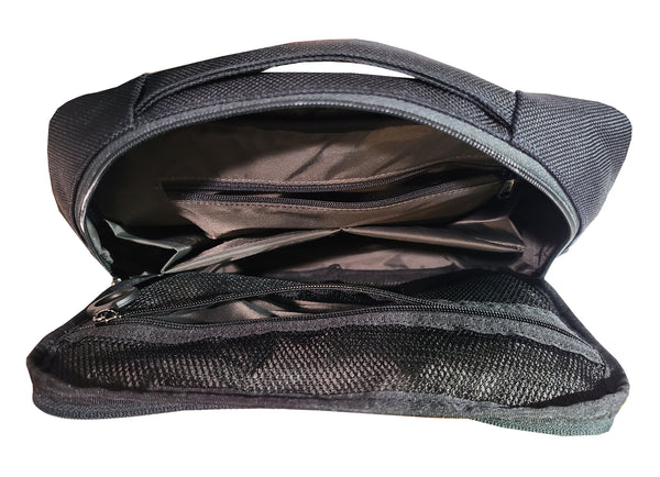 Inside view of Tech Pouch. Empty, showing the various inner pockets. One mesh zipper pocket. one small zipper pocket and 2 small padded and expandable pockets. The main compartment is padded for protecting your items.