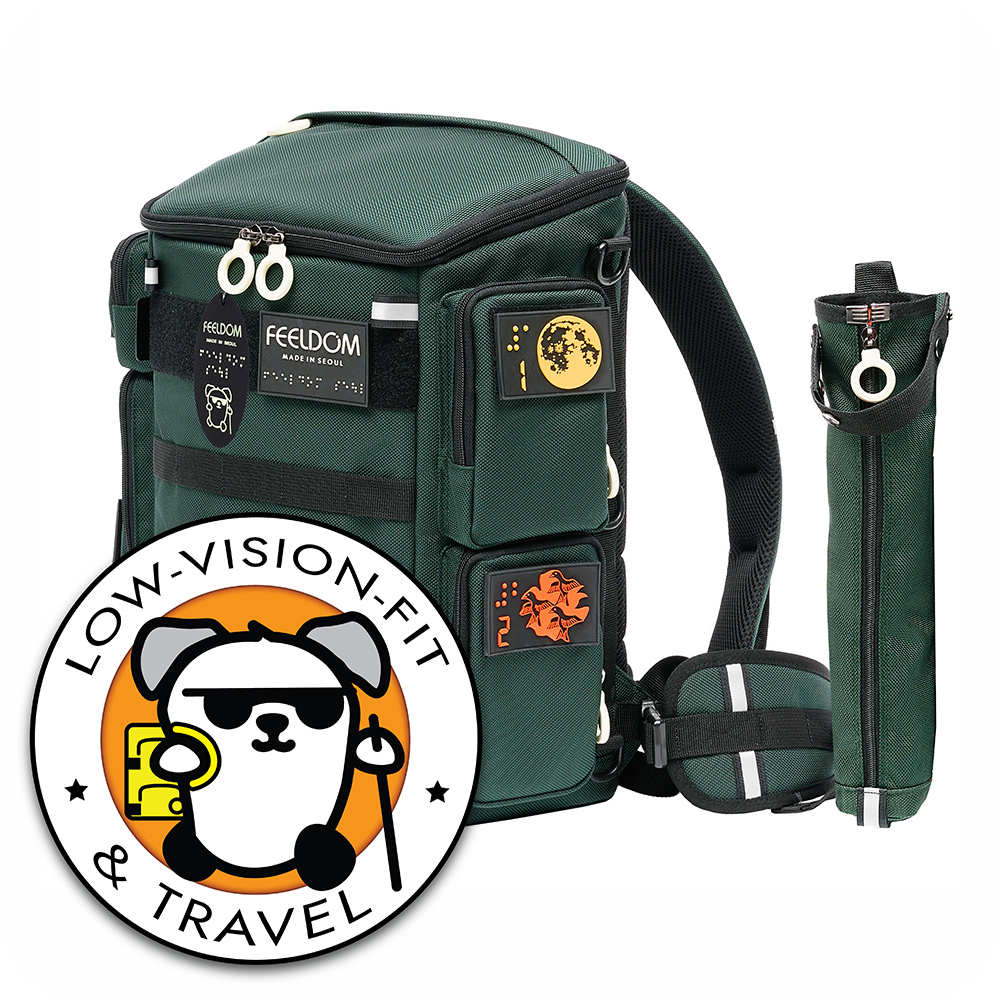 A forest green tactile backpack with a cane pouch and braille patches. Logo with a blind dog and Text: "LOW VISION FIT and TRAVEL"