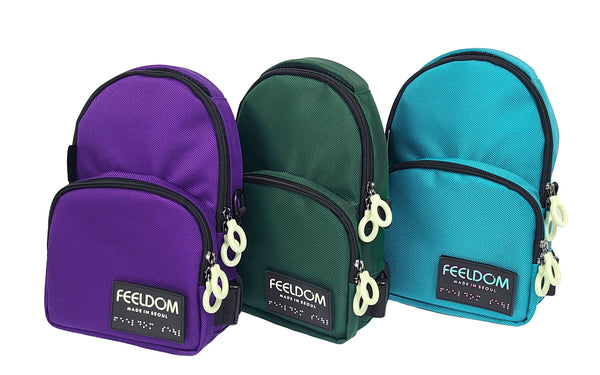 Three crossbody bags lined up: Purple, Forest Green and Aqua Blue