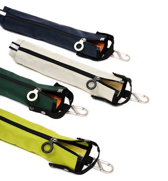 A collection of 4 differently colored cane pouches with ring zippers and a black zipper, trim and handle. There are silver metal s-shaped carabiners attached to each of the pouches at the top.