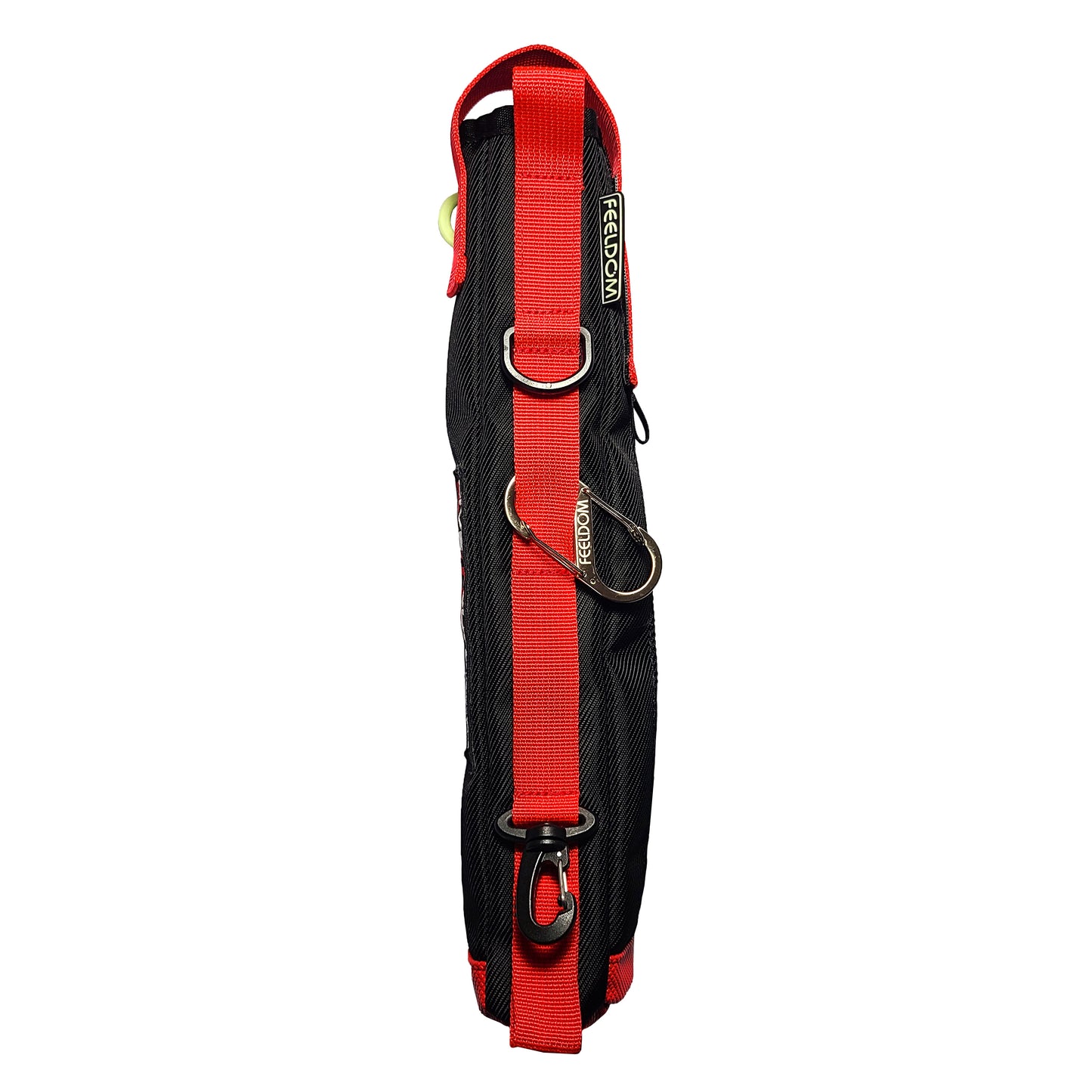 The back side of a black elongated pouch with a with prominent red webbing strap and loops along the whole side, a silver metal carabiner, D-ring, and black clip at the bottom.