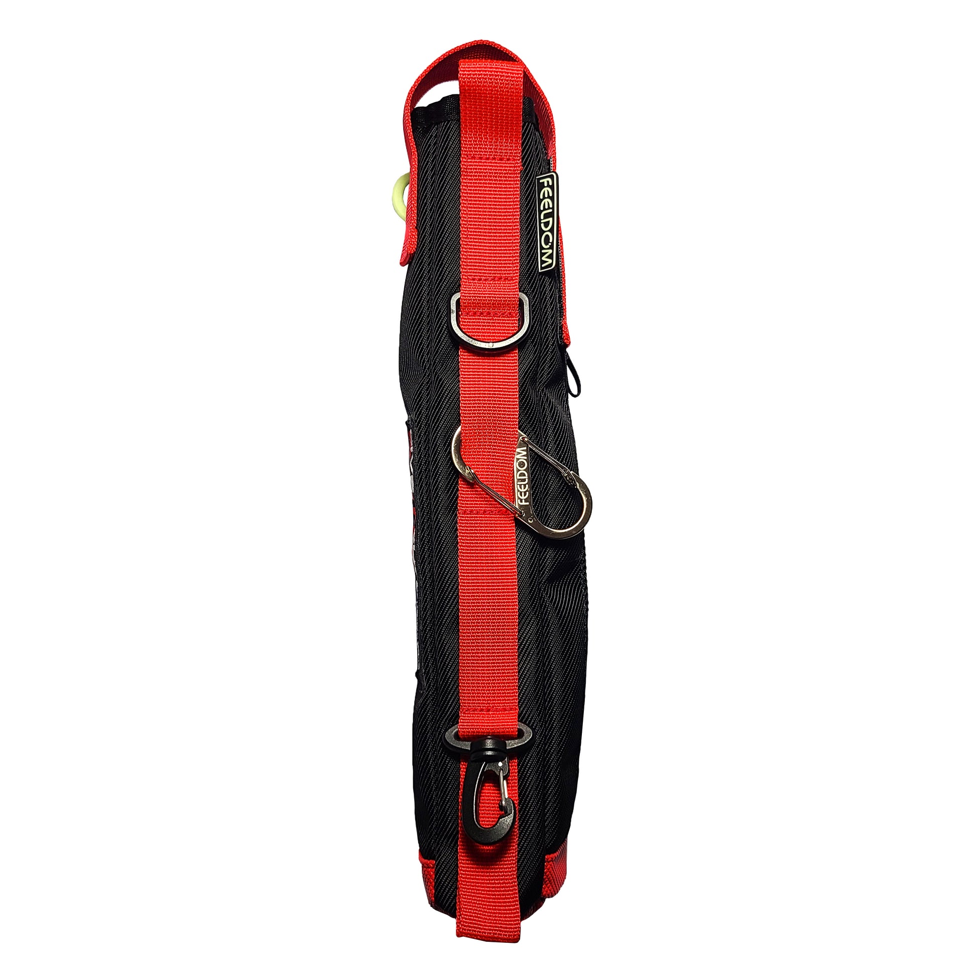 The back side of a black elongated pouch with a with prominent red webbing strap and loops along the whole side, a silver metal carabiner, D-ring, and black clip at the bottom.