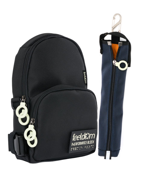A Black Jayu Crossbody with white Zipper rings and a navy blue cane pouch