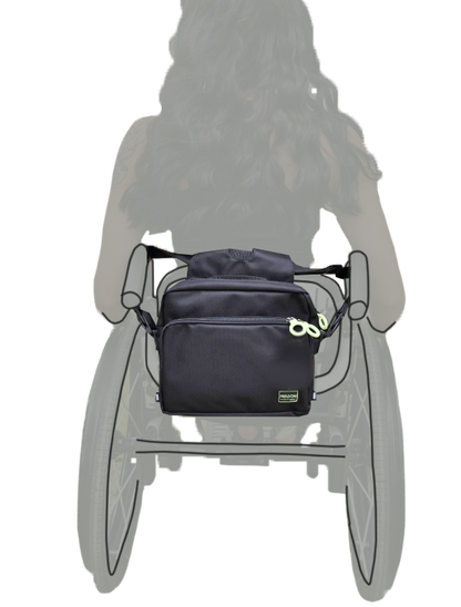 Black bag attached to back of a wheelchair 