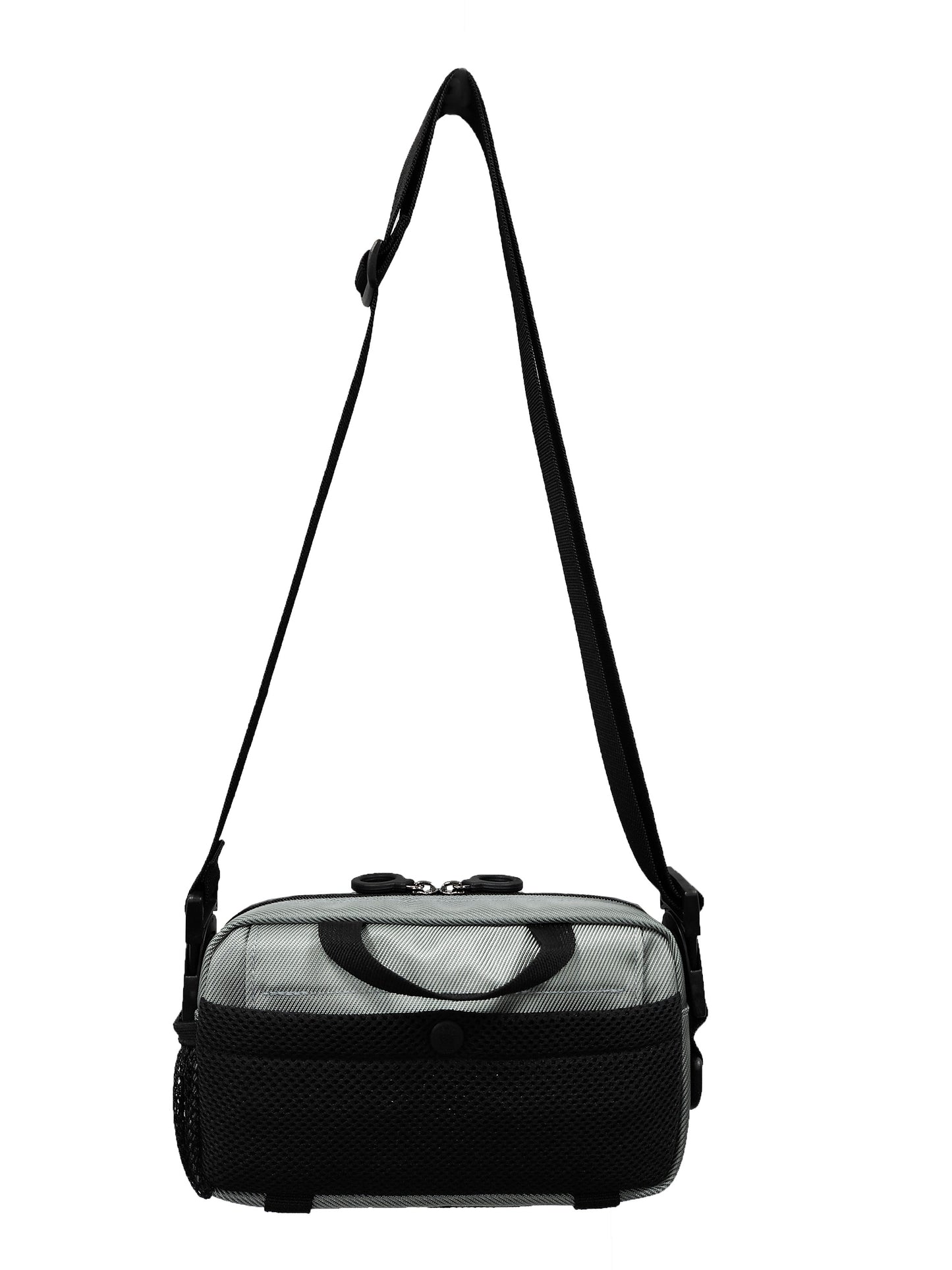 A small silver mini bag with a black pocket on the back. The black handle is also visible on the back.  The shoulder / crossbody strap is adjustable and made with a thick black nylon.