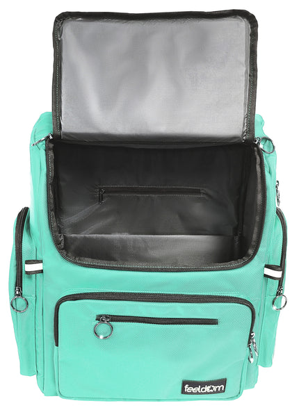 A light mint green wheelchair bag with black trim. The front opening lid is flipped up to show a gray lining and a laptop pouch inside.
