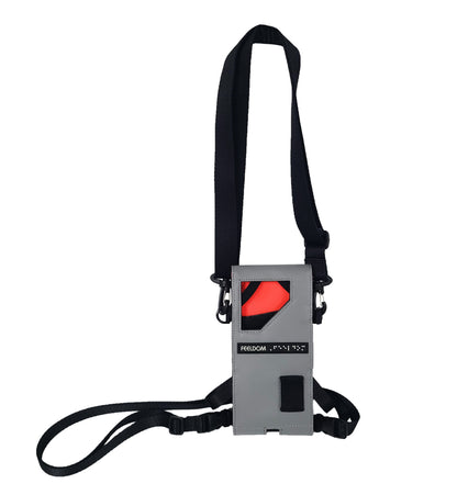 A gray rectangular pouch with a front window, red lining and black straps for the neck and waist.