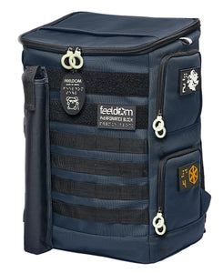 The front angle view of Performance Block HD-23 Large Backpack in Dark Navy. It has a cane pouch, white zipper rings on the openings, and both sides have 2 openings that lead to a double-decker inner compartment. There is a P.Block dog character keychain on the front, and there are 4 straps of Molle webbing and 2 wide strips of black velcro along the top and bottom.