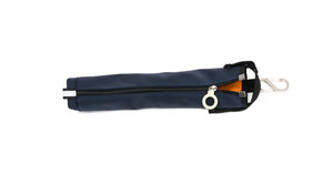 A navy blue cane pouch with an orange lining and white zipper ring