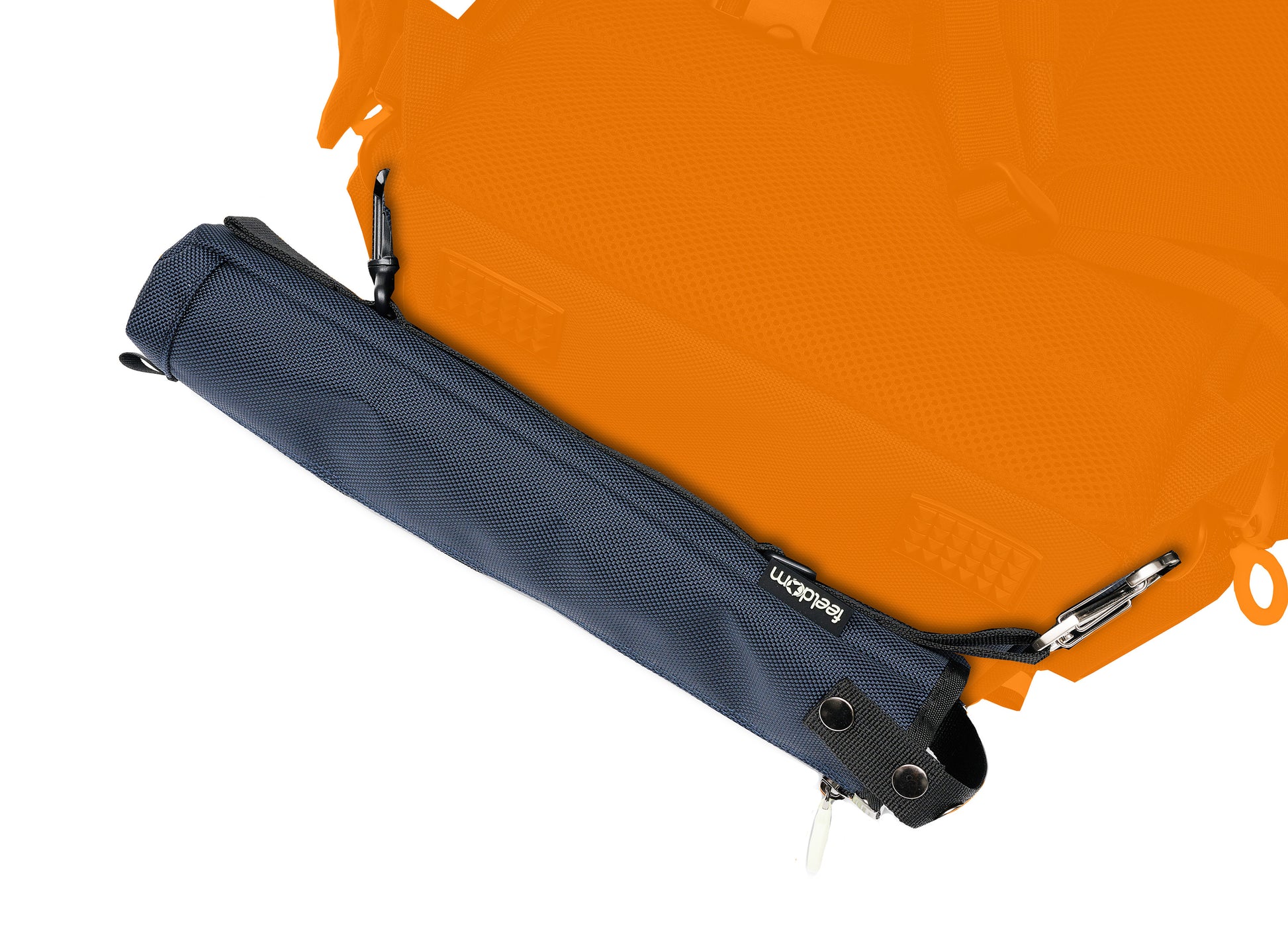 Close up detail of the cane pouch attached to the underside of the City Block backpack via clips on either end of the pouch and D rings located on the bottom end of both the left and right sides of the bag, with horizonal orientation. This makes the cane pouch easily accessible while wearing the backpack, but user should be cautious to tighten the strap closure to prevent the cane from sliding out accidentally.