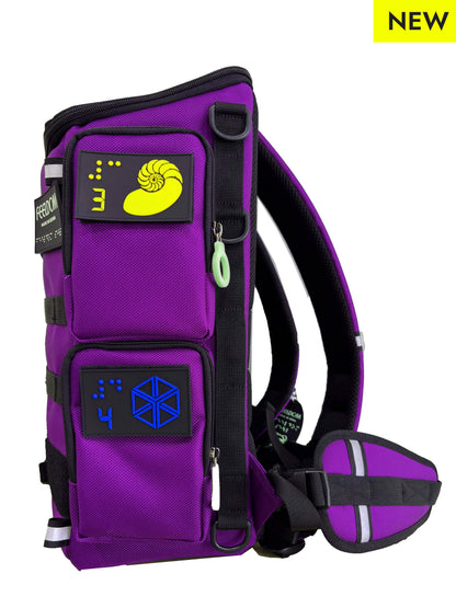 Purple backpack side view of two zippered pockets with Braille design patches. A padded waist belt is attached.