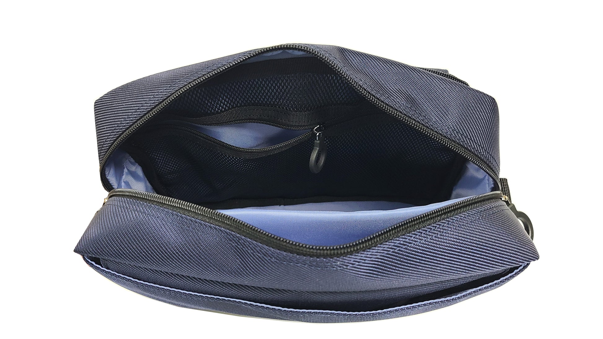 Top view of the inside of the adaptive bag showing a bright sky blue lining and black mesh zipper pouch with a ring zipper. There is a padded pouch for electronic items such as phone, tablet or e-reader, braill reader, ipad.