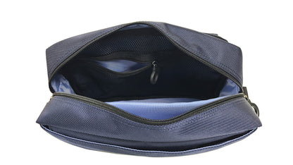 Top view of the inside of the adaptive bag showing a bright sky blue lining and black mesh zipper pouch with a ring zipper. There is a padded pouch for electronic items such as phone, tablet or e-reader, braill reader, ipad.