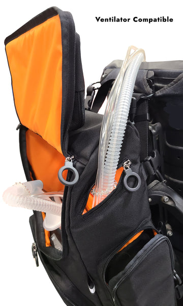 A side view of STAR Wheelchair bag with a ventilator inside. The front hatch is open, and the air tubes are going through the side sipper slot. It is on the back of a power wheelchair