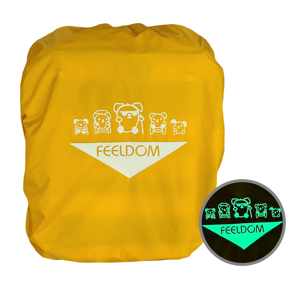 The front view of a yellow raincover put over the front of a backpack. The large design is in the middle. It glows in the dark. The design is the Feeldom logo in an inverted triangle, and above are 5 disability-inclusive doggie characters marching toward you.