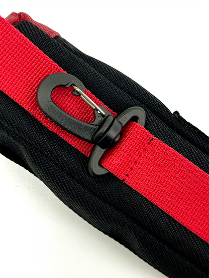 Close-up of a red webbing strap with a black plastic swiveling clip fixed to the back towards the bottom of the pouch.