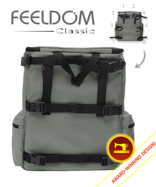 Rear view of a classic wheelchair bag shows the 8 black straps that are adjustable. They are buckled on and off easily, and there is also a black handle strap on the top. The red sewing machine icon reads "award winning design".