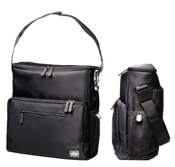 Feeldom Chic in all black double view. Left:  The tote bag has the shoulder strap attached for easy shoulder carry. Right:  Side view of the Chic Medium Tote bag shows mesh pockets and reflective tabs for safely. It is boxy but sleek and slim.