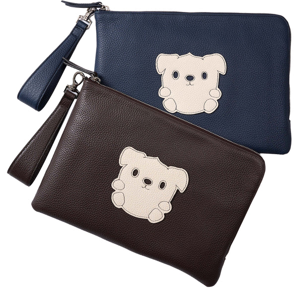 Two Luxury leather pouches, one Navy, one Chocolate brown. Both have an ivory leather relief patch of Goldie the Feeldom Service Pup, hand stitched onto the front of the pouch. Wrist clutch handle is removable, 12 inches.