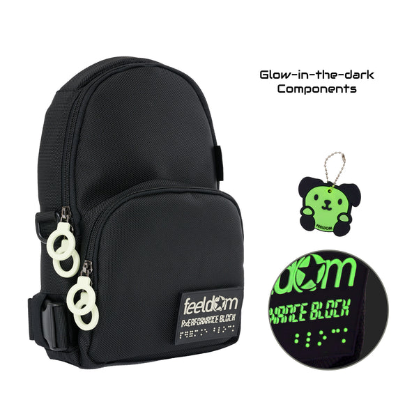 Caption reads:  Glow-in-the-dark Components, and a detail of a black and white/glow colored rubber dog character keychain and the Feeldom logo braille design patch that glows in the dark.