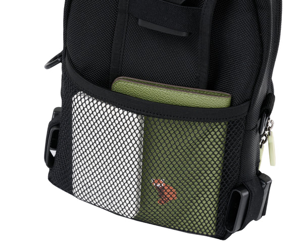 The back of the crossbody bag has a black mesh elastic pocket that runs halfway up the back of the bag. In there is a passport and a portable charging battery. The elastic band at the top of the pocket is snug and secure for smaller items.