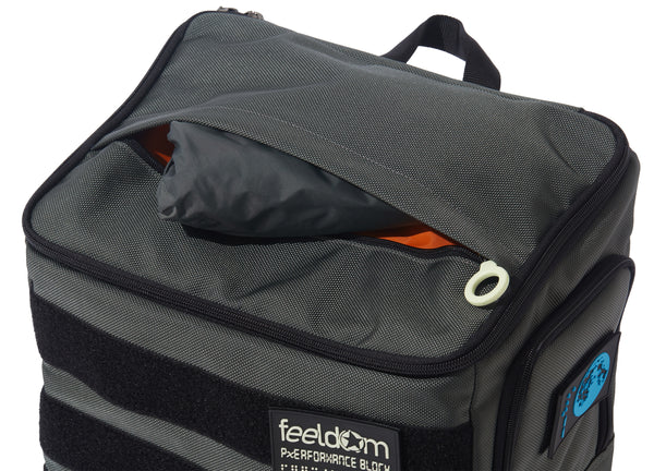 Top view of a large gray backpack with white zipper rings. The top has an outer pocket with a gray raincover inside