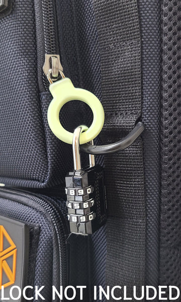 A Closeup of one outside pocket Ring zipper locked with a luggage lock to the D-ring which is adjacent to the ring zipper. Lock is not included with purchase.
