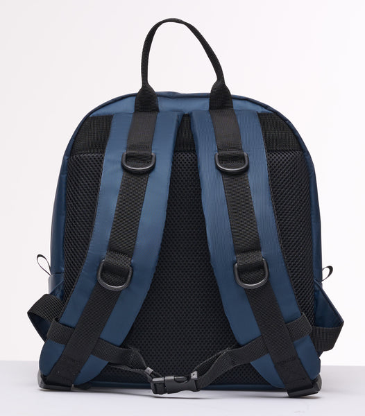 Back view of Buddy Sport Waterproof outdoor mini backpack. Dark blue waterproof nylon fabric is shiny. Black breathable padding on back and straps with black accents and D-rings for attaching accessories.  Adjustable chest strap.