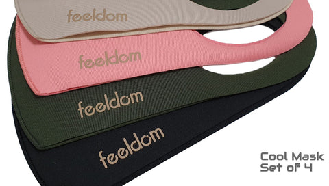 Close up view of 4 neoprene masks with the feeldom logo embossed on the lower edge. The colors are Black, Forest Green, Pink,  Beige. Text reads: Cool MasK Set of 4