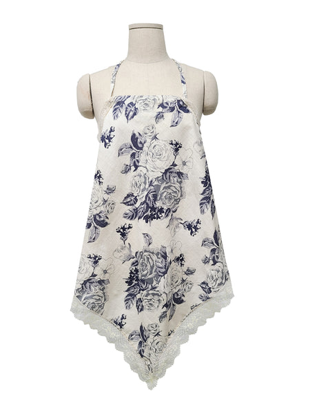 Feeldom's beautiful and elegant apron scarf is around the neck of a mannequin. It is a small travel apron with a Vintage rose pattern in Navy blue and gray. The antique style lace trim adds another touch of class to an already classy apron that also works as a scarf!