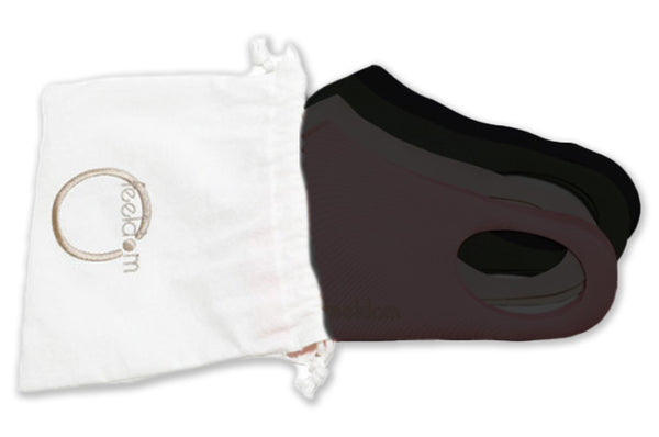 4 masks which are all black. They are stacked neatly and halfway inserted into a white cotton drawstring pouch. The pouch has a beige Feeldom logo embroidered on the front.