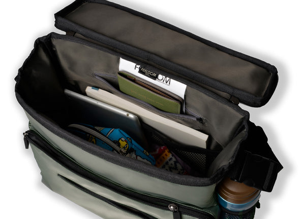 Feeldom Chic Medium Tote bag top view. Lid is a rectangle box-open type zipper top.  When the tote bag is open, the inner compartment is full of items such as an ipad, book, passport, wallet , pencil case and headphones. Rigid padded structure of Chic makes it stand up even when empty!