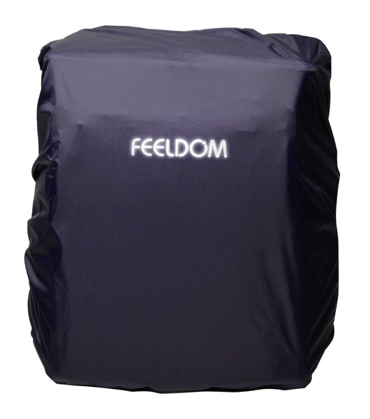 A dark navy blue water proof rain cover that is stretched over the whole backpack. The Feeldom logo is reflective in the light.